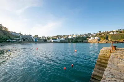 a river with red balls in the water at 3 Bed in Gorran Haven oc-p00812 in Gorran Haven