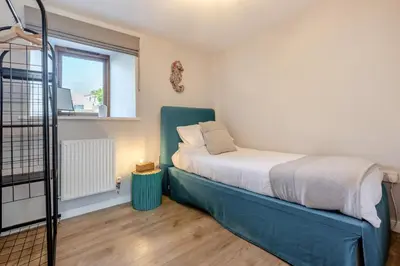a bedroom with a bed and a window at 3 Bed in Mawgan Porth oc-p00824 in Mawgan Porth