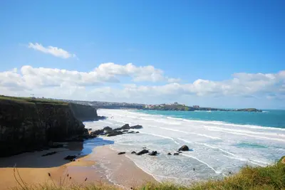 a view of a beach with rocks in the water at 2 Bed in Talskiddy oc-p00844 in Saint Columb Major
