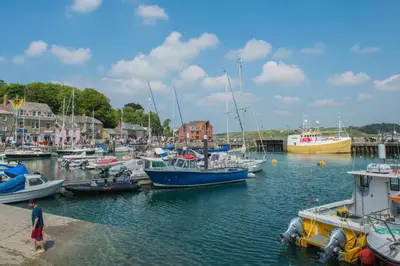 a group of boats docked in a harbor at 2 Bed in Talskiddy oc-p00844 in Saint Columb Major