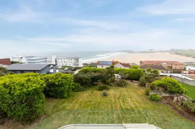 an aerial view of a yard with the ocean in the background at 5 Bed in Newquay oc-p00894 in Newquay