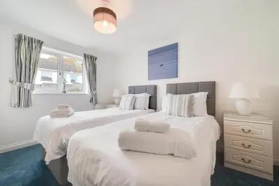a bedroom with two beds with white sheets at 2 Bed in Porthleven oc-p00972 in Porthleven