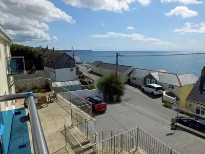 a balcony of a house with a view of the water at 2 Bed in Porthleven oc-p00972 in Porthleven