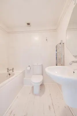 a white bathroom with a toilet and a sink at 2 Bed in Porthleven oc-p00972 in Porthleven