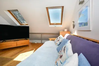 a living room with a couch and a flat screen tv at 1 Bed in St. Ives oc-pc1010 in St Ives
