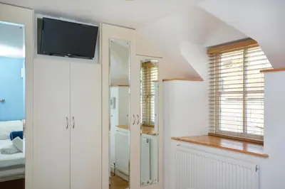 a living room with a tv and a bedroom at 1 Bed in St. Ives oc-pc1010 in St Ives