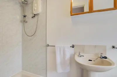 a bathroom with a sink and a shower at 1 Bed in St. Ives oc-pc716a in St Ives