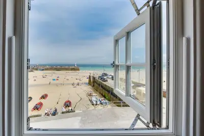 a view of a beach from a window at 2 Bed in St Ives oc-pc055a in St Ives