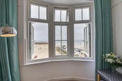 a room with a window with a view of the beach at 2 Bed in St Ives oc-pc055a in St Ives