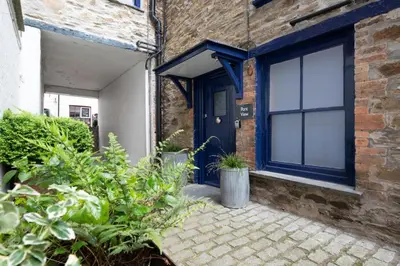 a brick house with a blue door at 2 Bed in Fowey oc-pont in Fowey