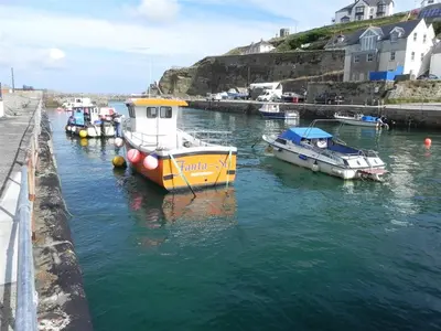 a group of boats are docked in a harbor at 3 Bed in Portreath oc-pc054 in Portreath