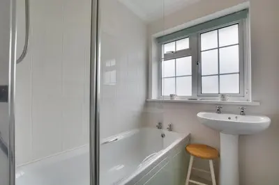 a bathroom with a tub and a sink and a shower at 3 Bed in Portreath oc-pc054 in Portreath
