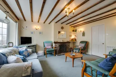 a living room with a couch and a table at 3 Bed in Portreath oc-pc054 in Portreath