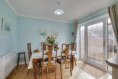 a dining room with a table and chairs at 3 Bed in Portreath oc-pc054 in Portreath