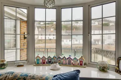 a living room with windows and a table with houses on it at 3 Bed in Portreath oc-pc054 in Portreath