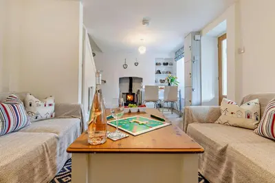a living room with two couches and a table at 2 Bed in Wadebridge oc-r27444 in Little Petherick