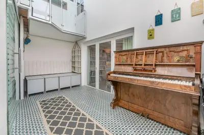 an empty room with a piano in a building at 4 Bed in Porthleven oc-samcot in Porthleven