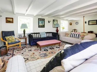 a living room with couches and a rug at 4 Bed in Rock oc-r27255 in Saint Minver