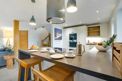 a kitchen with a large counter top in a room at 3 Bed in Trevone oc-stcad in Padstow