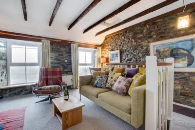 a living room with a couch and a chair at 2 Bed in Porthleven oc-stmich in Porthleven