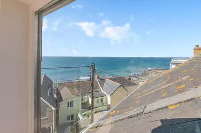 a view of the ocean from a window at 2 Bed in Porthleven oc-suffol in Porthleven