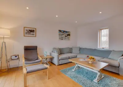 a living room with a couch and a table at 2 Bed in Porthleven oc-shorse in Porthleven