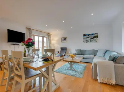 a living room with a table and a couch at 2 Bed in Porthleven oc-shorse in Porthleven