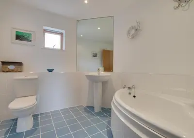 a bathroom with a toilet and a sink and a tub at 2 Bed in Porthleven oc-shorse in Porthleven