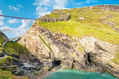 a suspension bridge over a river on a mountain at 3 Bed in Tintagel oc-trev5 in Treknow
