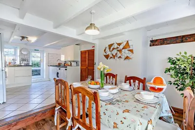 a kitchen and dining room with a table and chairs at 3 Bed in St. Issey oc-v27518 in Saint Issey