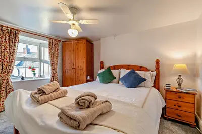 a bedroom with a bed with towels on it at 3 Bed in St. Issey oc-v27518 in Saint Issey