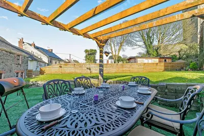 a table and chairs on the patio of a house at 3 Bed in St. Issey oc-v27518 in Saint Issey