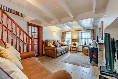 a living room with couches and a fireplace at 3 Bed in St. Issey oc-v27518 in Saint Issey