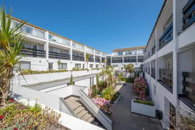 an apartment building with a courtyard with plants at 2 Bed in St. Ives oc-18stn in St Ives