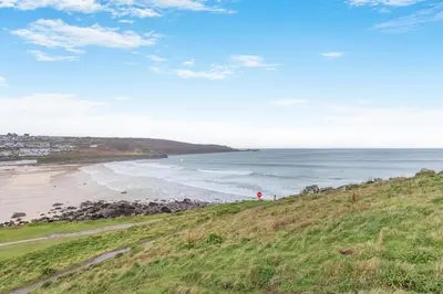 a view of the beach from the top of a hill at 2 Bed in St. Ives oc-18stn in St Ives