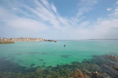 a large body of water with a city in the background at 2 Bed in St. Ives oc-1seab in St Ives