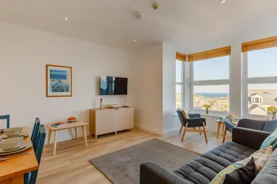 a living room with a couch and a table at 2 Bed in St. Ives oc-1seab in St Ives