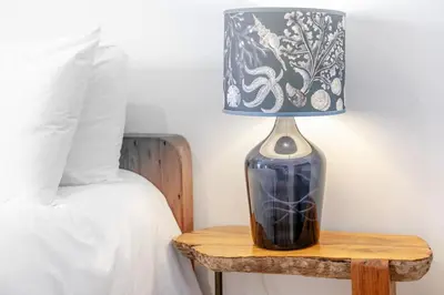 a lamp sitting on a table next to a bed at 2 Bed in St. Ives oc-6acarr in St Ives