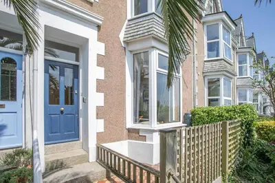 a house with a blue door and a fence at 2 Bed in St. Ives oc-6acarr in St Ives