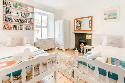 two beds in a room with a fireplace at 2 Bed in St. Ives oc-6acarr in St Ives