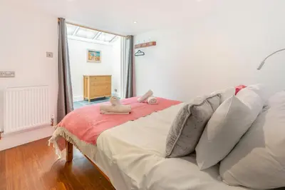 a bedroom with a bed with two stuffed animals on it at 2 Bed in St. Ives oc-6carr in St Ives