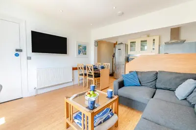 a living room with a couch and a table at 2 Bed in St. Ives oc-6carr in St Ives
