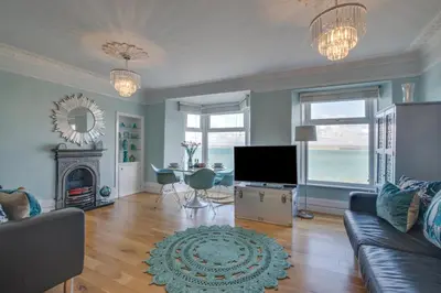 a living room with a couch and a television at 1 Bed in St. Ives oc-aqua19 in St Ives