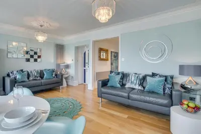 a living room with two couches and a table at 1 Bed in St. Ives oc-aqua19 in St Ives