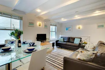 a living room with a table and a couch at 3 Bed in St Ives oc-bail05 in St Ives
