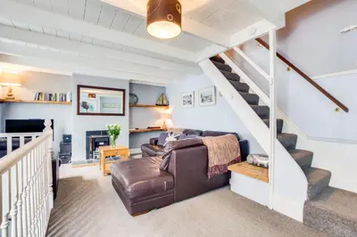 a living room with a couch and stairs at 3 Bed in St Ives oc-bail06 in St Ives