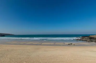a sandy beach with the ocean in the background at 2 Bed in St Ives oc-bpp15 in St Ives