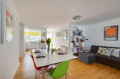 a living room with a table and chairs and a couch at 2 Bed in St Ives oc-bpp15 in St Ives
