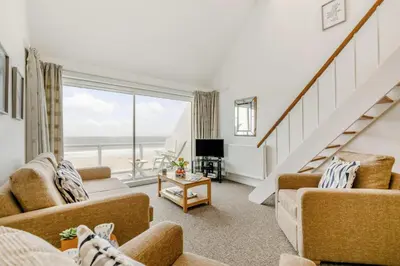 a living room with a view of the ocean at 1 Bed in St Ives oc-bpp21 in St Ives