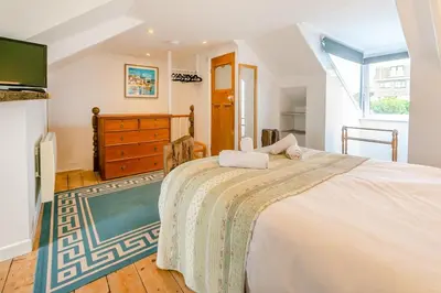 a bedroom with a large bed in a room at 4 Bed in St. Ives oc-brhous in St Ives